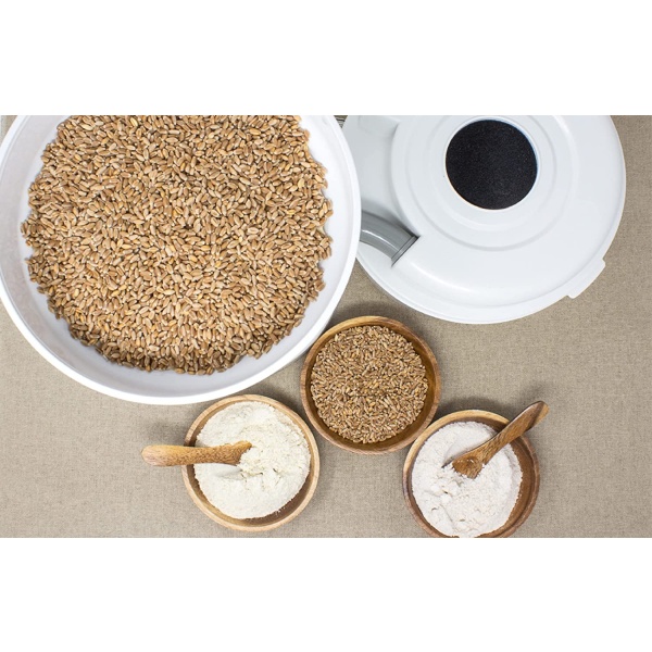 A bowl of wheat seeds and a bowl of Wonder Mill Grinder Electric- (SHIPS IN 1-2 WEEKS).