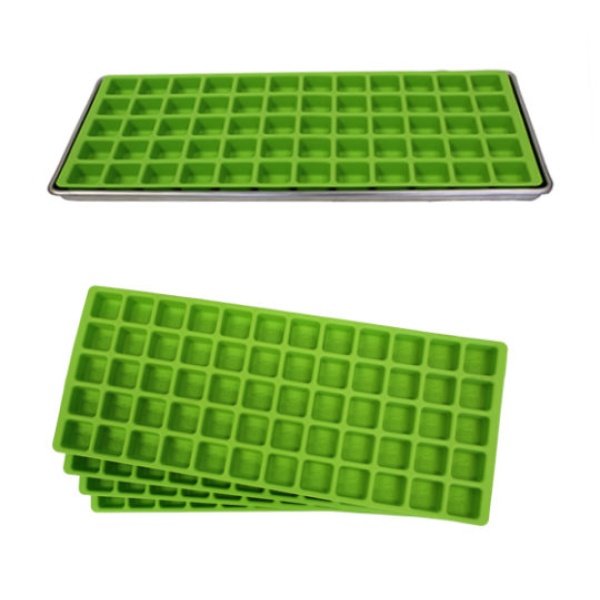 A set of green silicone ice cube trays on a white surface.