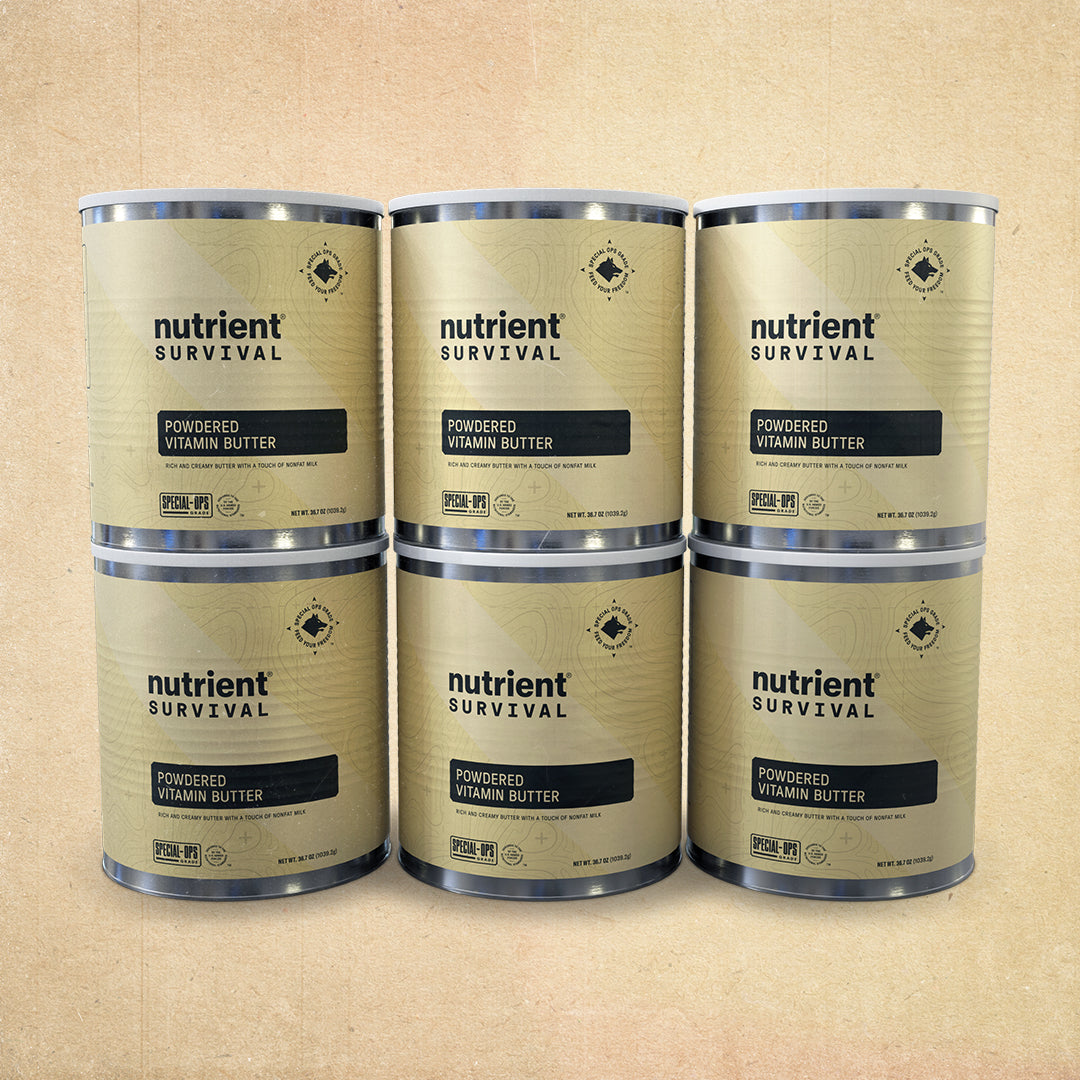 Four cans of nutrient survival powdered vitamin butter powder on a white background.