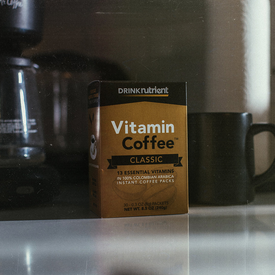 A box of Nutrient Survival Vitamin Coffee sitting on a counter.