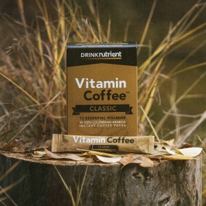 Vitamin coffee on a tree stump.