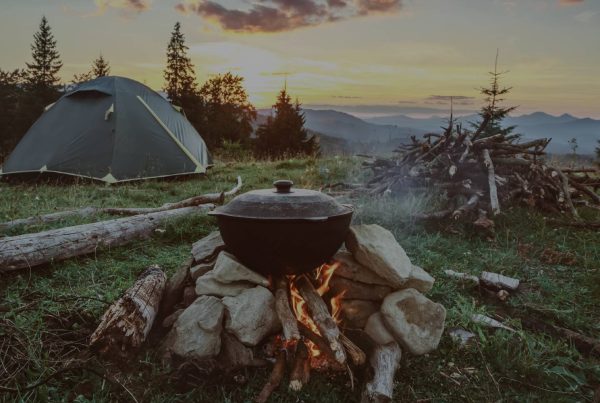 A first extreme outdoor activity guide featuring a campfire and mountains.