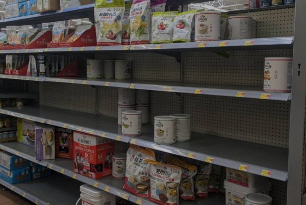 An empty shelf in a grocery store during food shortages.