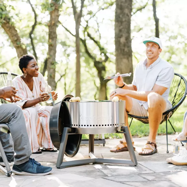 A group sitting around a "portable" fire pit.