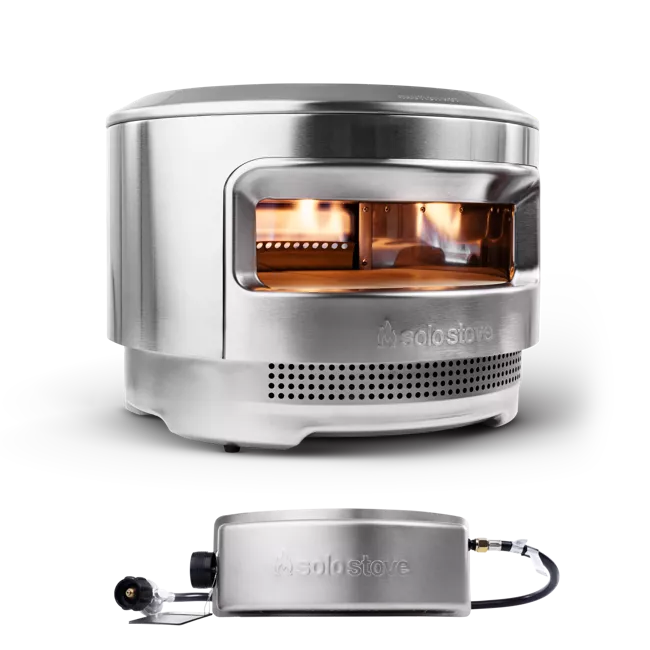 A portable stainless steel stove with two burners and a remote control.
