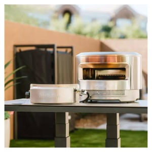 A portable stainless steel grill.