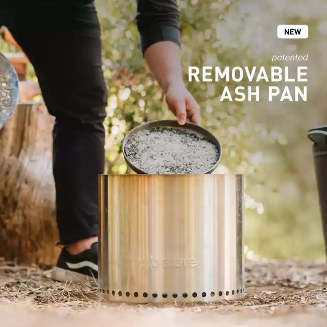 A man is preparing a portable stainless steel ash pan.
