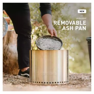 A man is preparing a reusable ash pan for his Solo Stove Ranger.