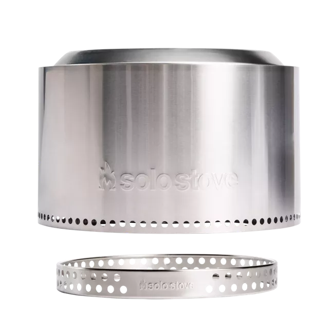 A portable stainless steel pot with a hole in it.