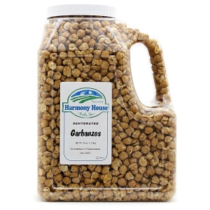 A jar of peanuts on a white background with "Harmony House Garbanzo Beans" (4 lbs) label.
