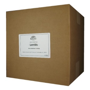 A brown box with a label on it containing Harmony House Lentils (25 lbs).