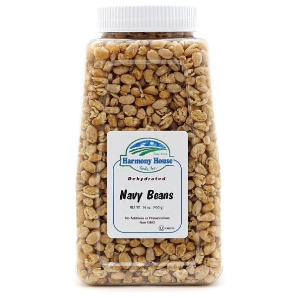A jar of Harmony House Navy Beans on a white background.