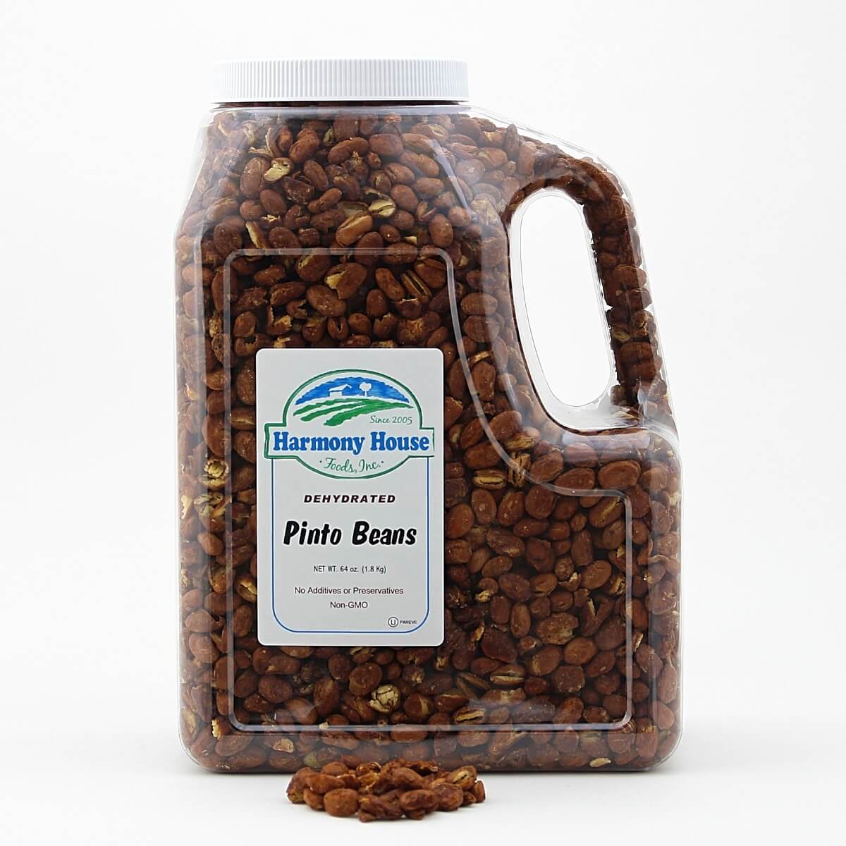 A jug of peanuts on a white background, Harmony House Pinto Beans (4 lbs).