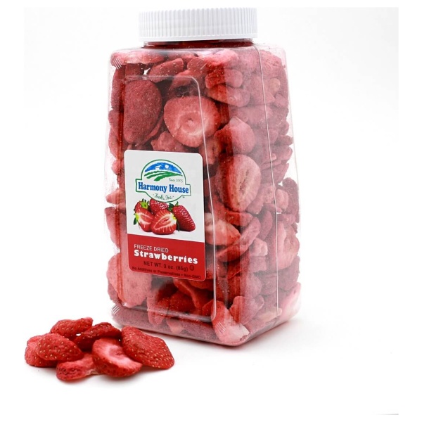 A jar of sliced Harmony House Freeze Dried Strawberries (3 oz) sitting on a white surface.