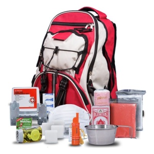 A Wise Company red backpack with a variety of gear and survival items.