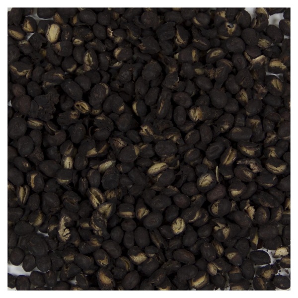 A pile of black seeds on a white surface, Harmony House Black Beans.