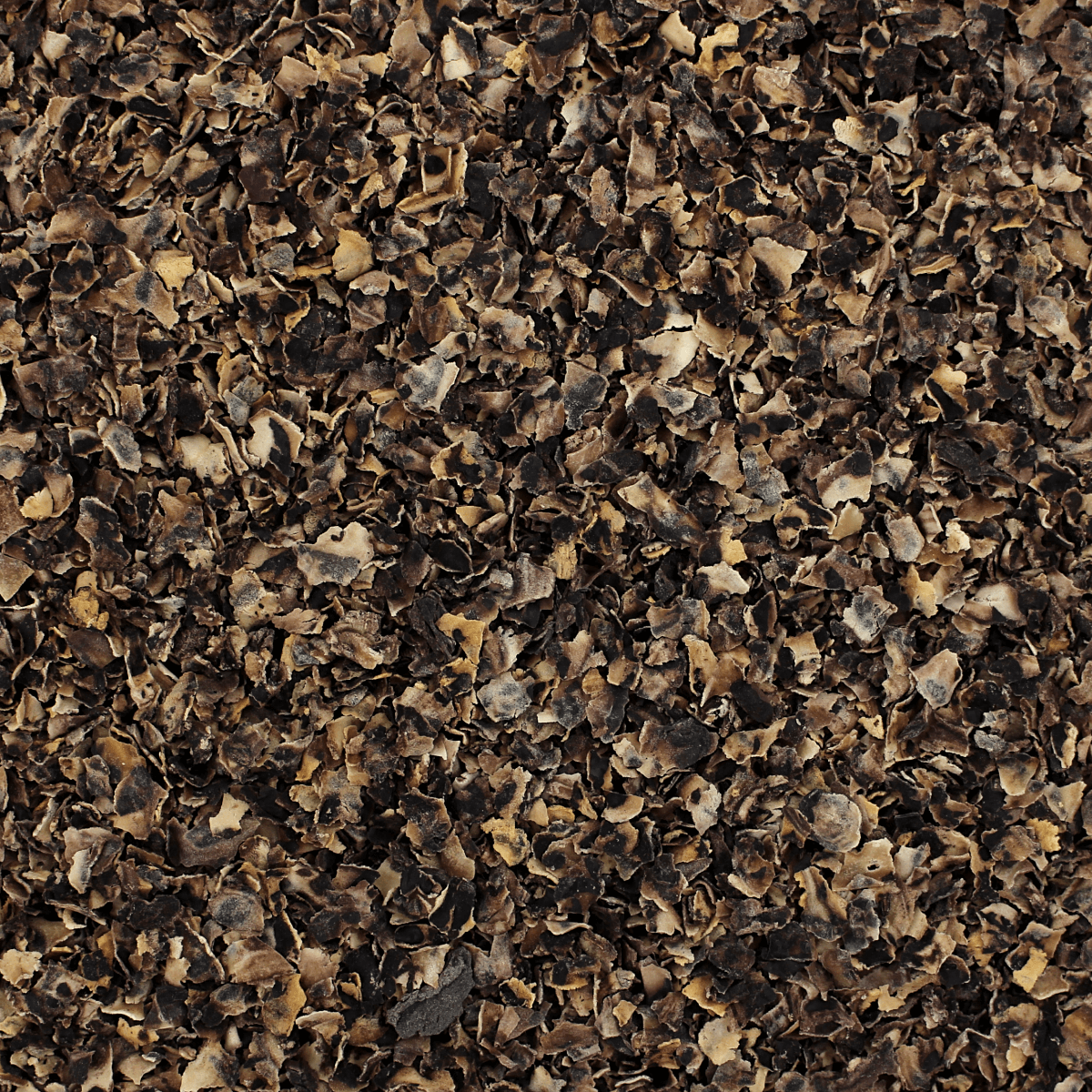 A close up of a pile of black leaves.
