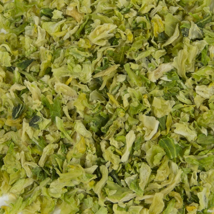 Shredded brussels sprouts on a white surface with Harmony House Dried Cabbage.