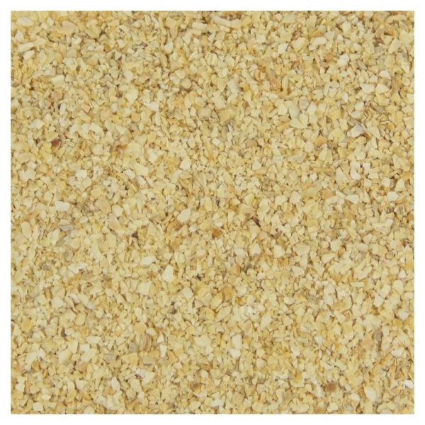 A close up image of yellow sand with gourmet minced garlic.