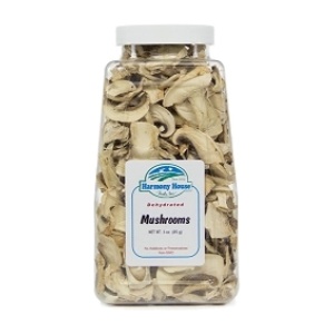 A jar of sliced mushrooms on a white background.