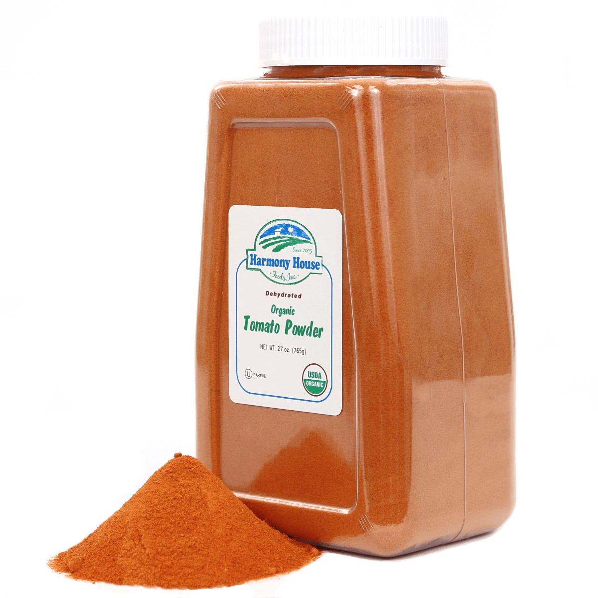 A Harmony House jar of red curry powder on a white background.