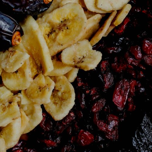 A pile of dried bananas, cranberries and raisins, highlighting the history of dehydrated foods and current day solutions.