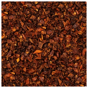A close up image of a pile of brown spices, including Harmony House Dried Tomato Dices (32 oz).