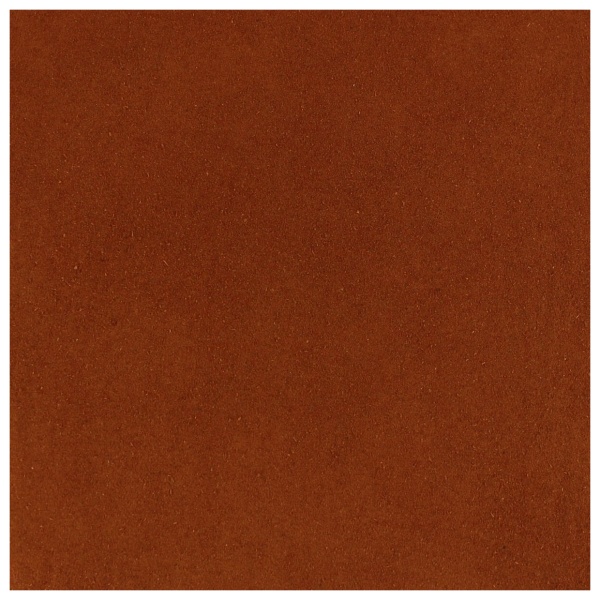 A close up image of a brown background with Harmony House Tomato Powder.
