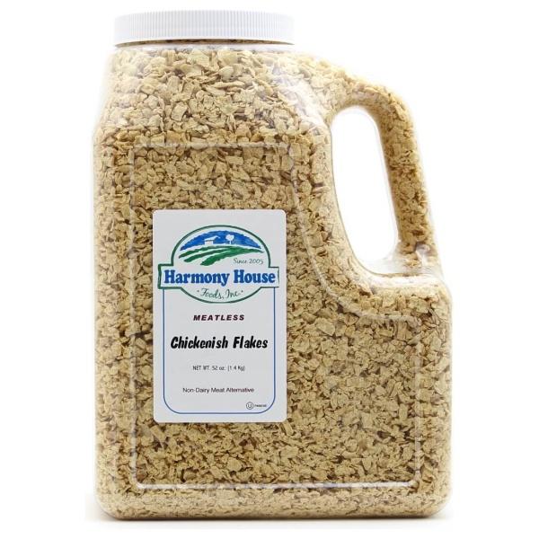A gallon of oats on a white background - Harmony House Chicken Style Flakes.