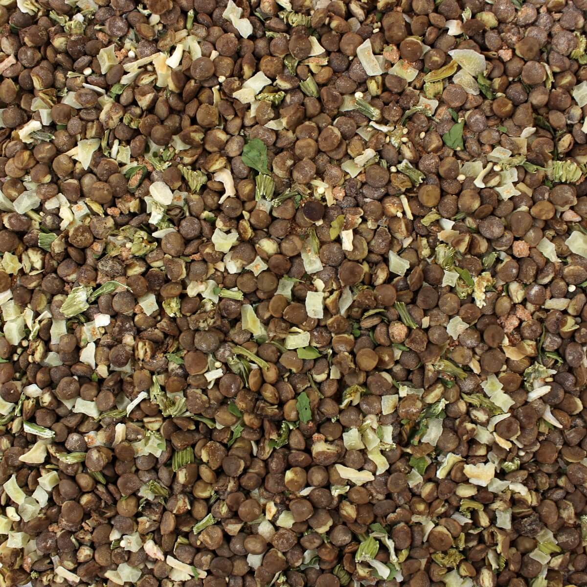 A close up image of a pile of brown seeds sold by Harmony House.
