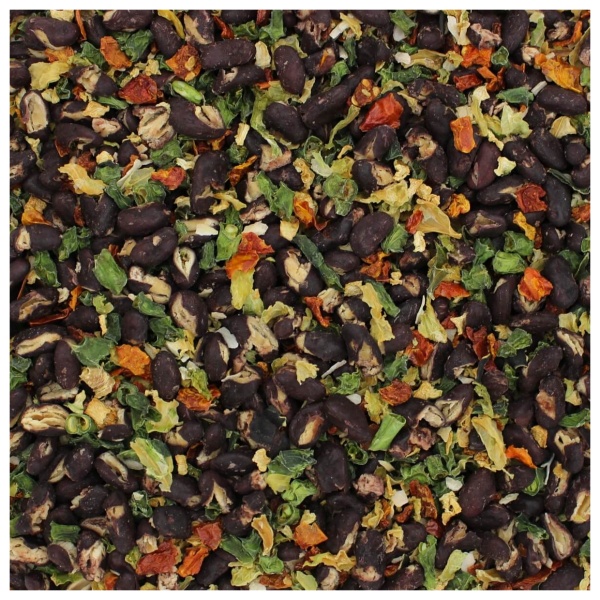 A close up of a pile of black beans and spices from the Harmony House Italian Vegetable Soup Mix.