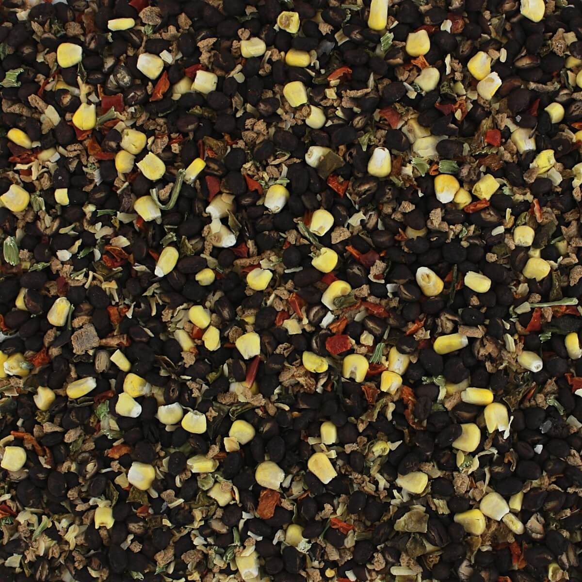 A close up of a pile of black and yellow seeds from Harmony House Soup and Chili Mix Sampler.
