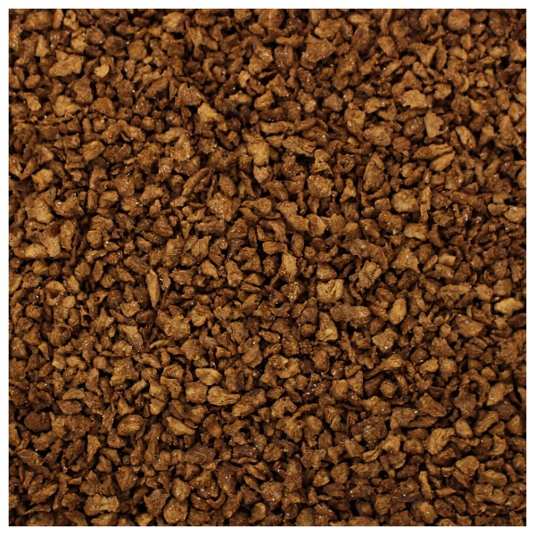 A close up of a pile of brown granules from Harmony House Beef Flavored Bits.