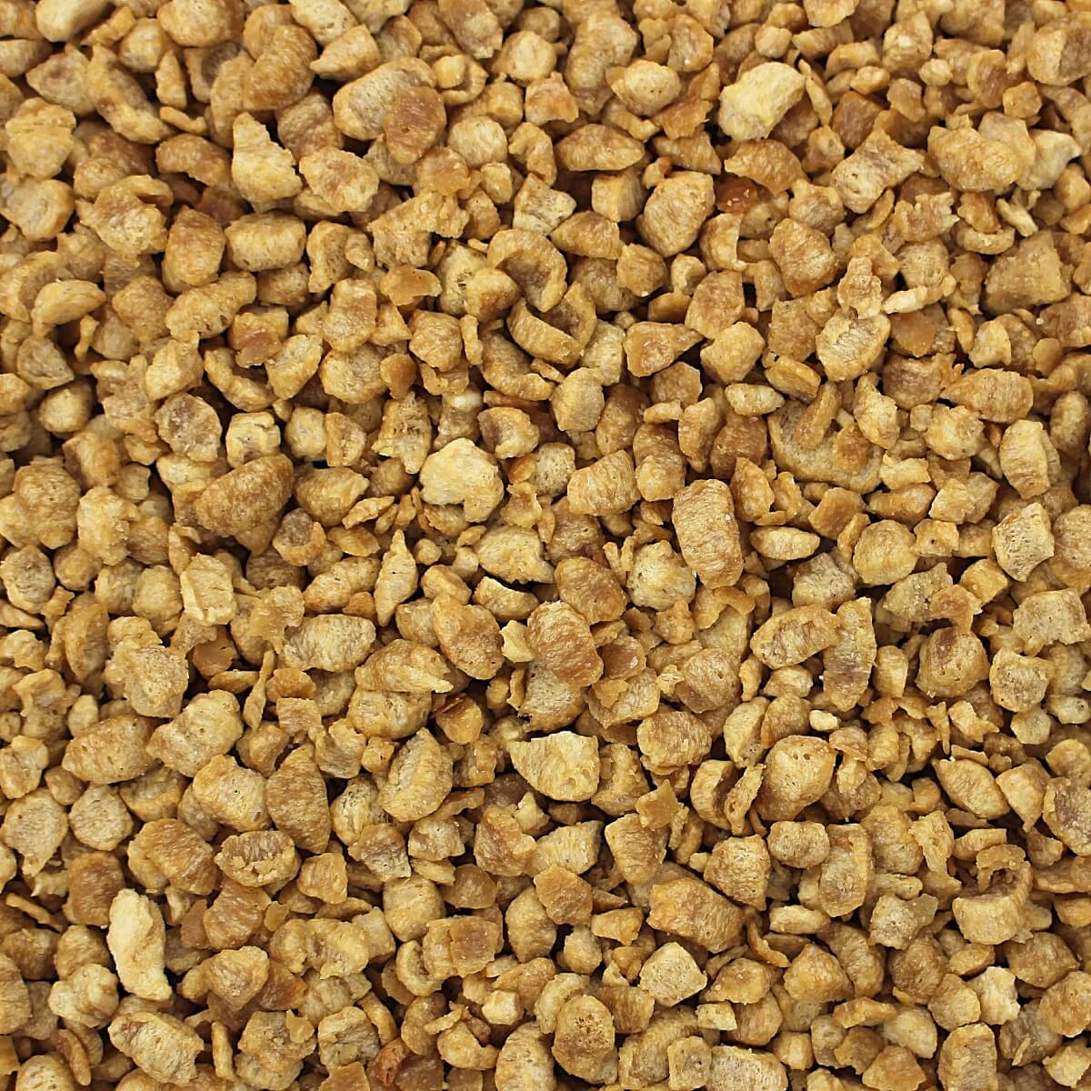 A close up image of a pile of brown granola from Harmony House Deluxe Plant-Based Protein Sampler.
