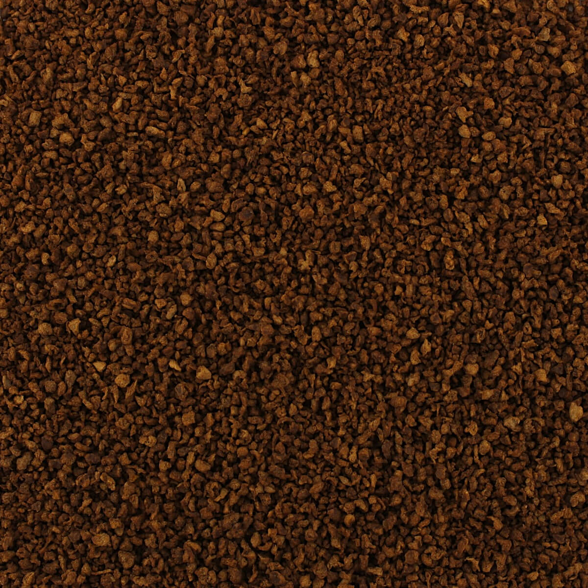 A close up image of a brown sand texture. (Sand, texture)