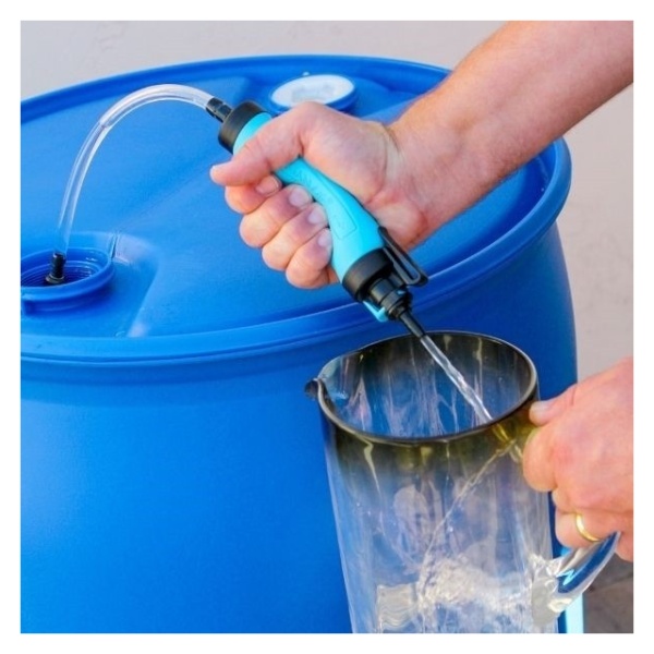 A person pouring water into a bucket for emergency food storage.