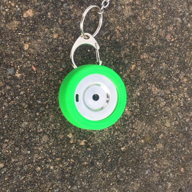 A keychain with a white circle on it, perfect for emergency food storage.