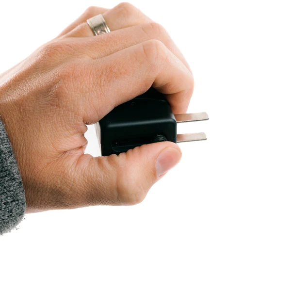 A person's hand holding a LifeShield USB charger.