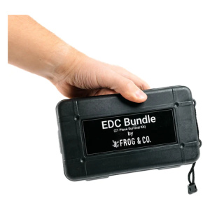 A person holding a black EDC Survival Bundle case with the words Frog & Co.