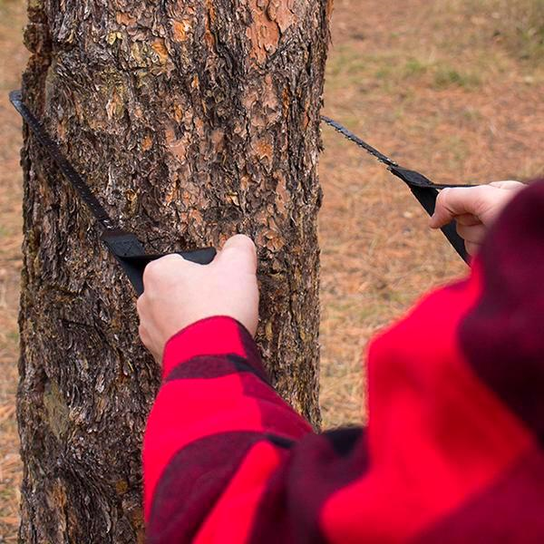 A person cutting a tree with a pair of Pocket Chainsaw.