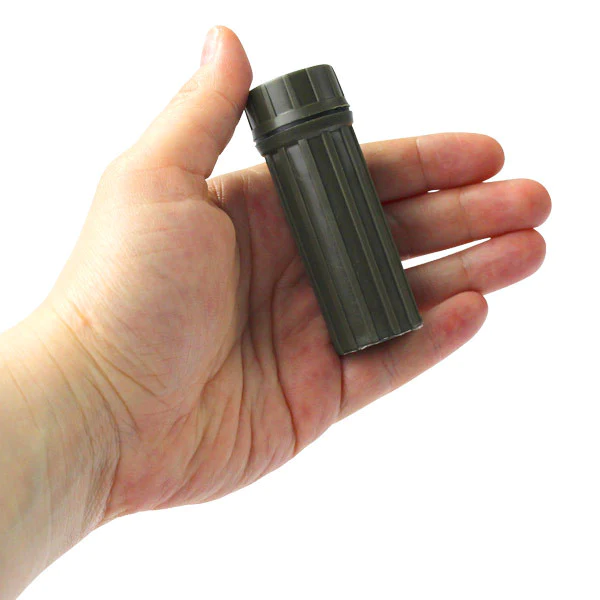 A person's hand holding a waterproof case.