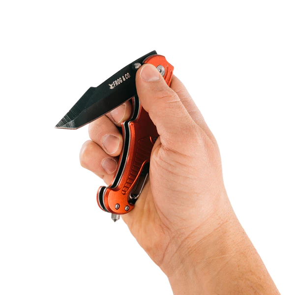 A person holding a knife with an orange handle, also known as the Red Survival Pocket Knife.
